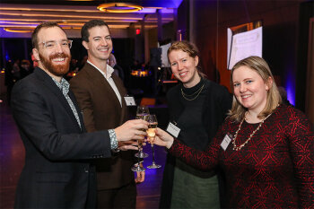 Group posing for photo at reception event