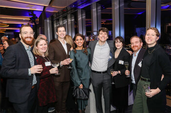 Group posing for photo at reception event