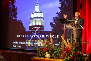 A guest speaker on stage presenting