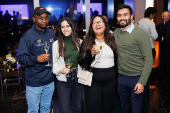 4 people posing for photo