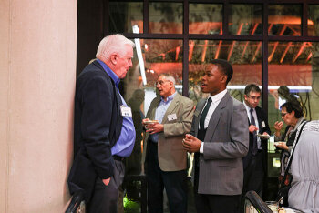 Various attendees having one to one conversations