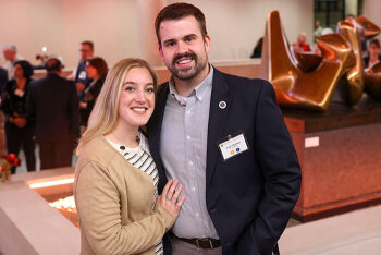 A man and woman pose for a photo