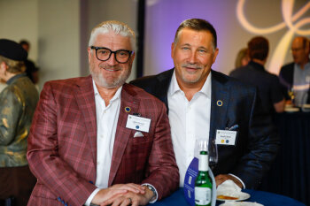 Two attendees smile for a photo while enjoying the George Eastman Circle Faculty & Staff Reception on March 19, 2025.