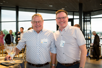 2 guys smiling for the camera
