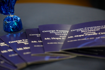 A group of brochures fanned out onto a table
