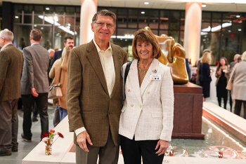 A man and woman pose for a photo
