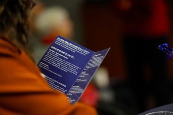 A person reading a brochure
