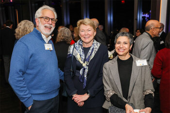 Group posing for photo at reception event