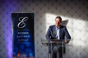 Thomas Farrell ’88, ’90W addresses attendees at the podium during the 2025 George Eastman Circle Faculty & Staff Reception.