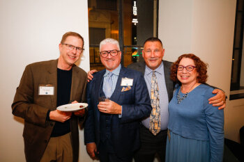 A group of attendees pose for a photo at the George Eastman Circle Annual Member Dinner.
