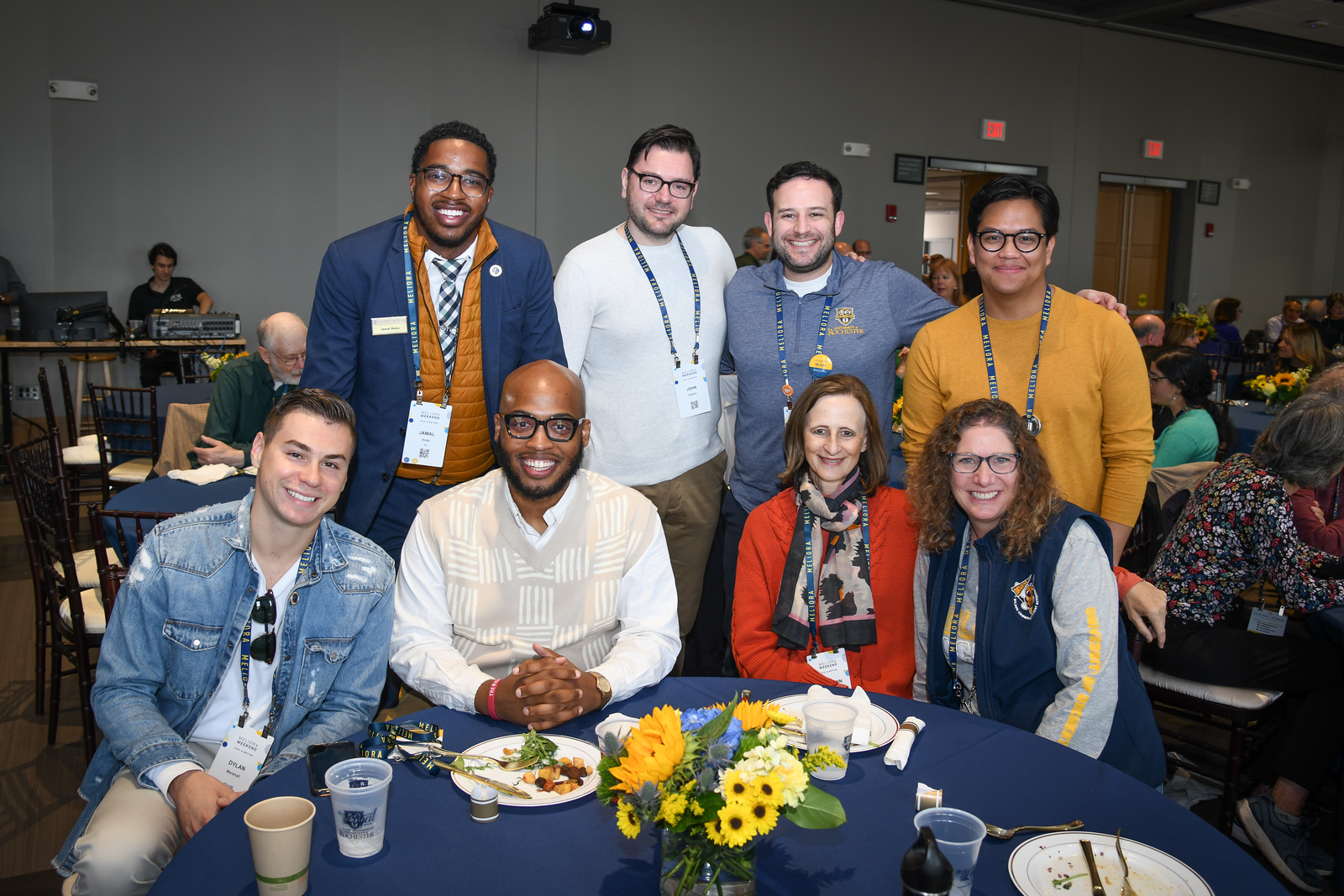 Group of people posing at a table