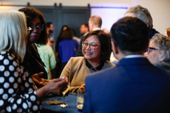 Attendees chat and enjoy refreshments at the George Eastman Circle Faculty & Staff Reception in Rochester.