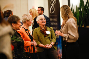 Attendees making small talk at the George Eastman Circle Annual Member Dinner.