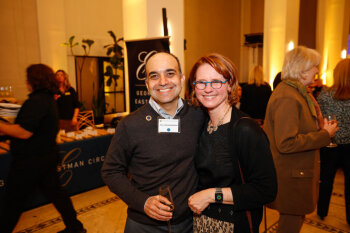 A man and woman pose for a photo at the George Eastman Circle Annual Member Dinner.
