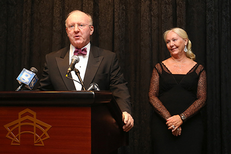 University Trustee Tom Wilmot and Judy Wilmot Linehan encourage attendees—many of whom were George Eastman Circle members—to join them in supporting cancer research at the Wilmot Cancer Institute during the 15th annual Discovery Ball.