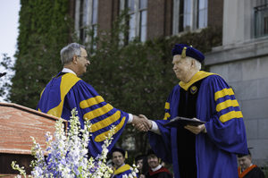 UR president Joel Seligman awards the Charles Force Hutchison and Marjorie Smith Hutchison Medal to Joseph F. Cunningham '67. (MA) // University of Rochester College of Arts and Sciences commencement ceremony at the River Campus May 17, 2015. // photo by J. Adam Fenster / University of Rochester