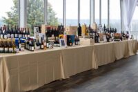 line of tables holding various bottles of wine