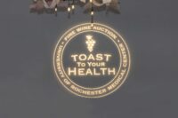 toast to your health logo projected on the wall