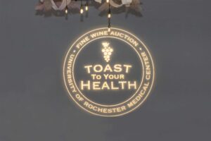 toast to your health logo projected on the wall