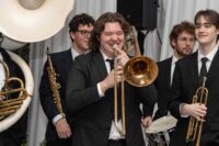 trombone player smiling while playing