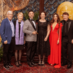 President Sarah C. Mangelsdorf posing in a group photo with 5 other people