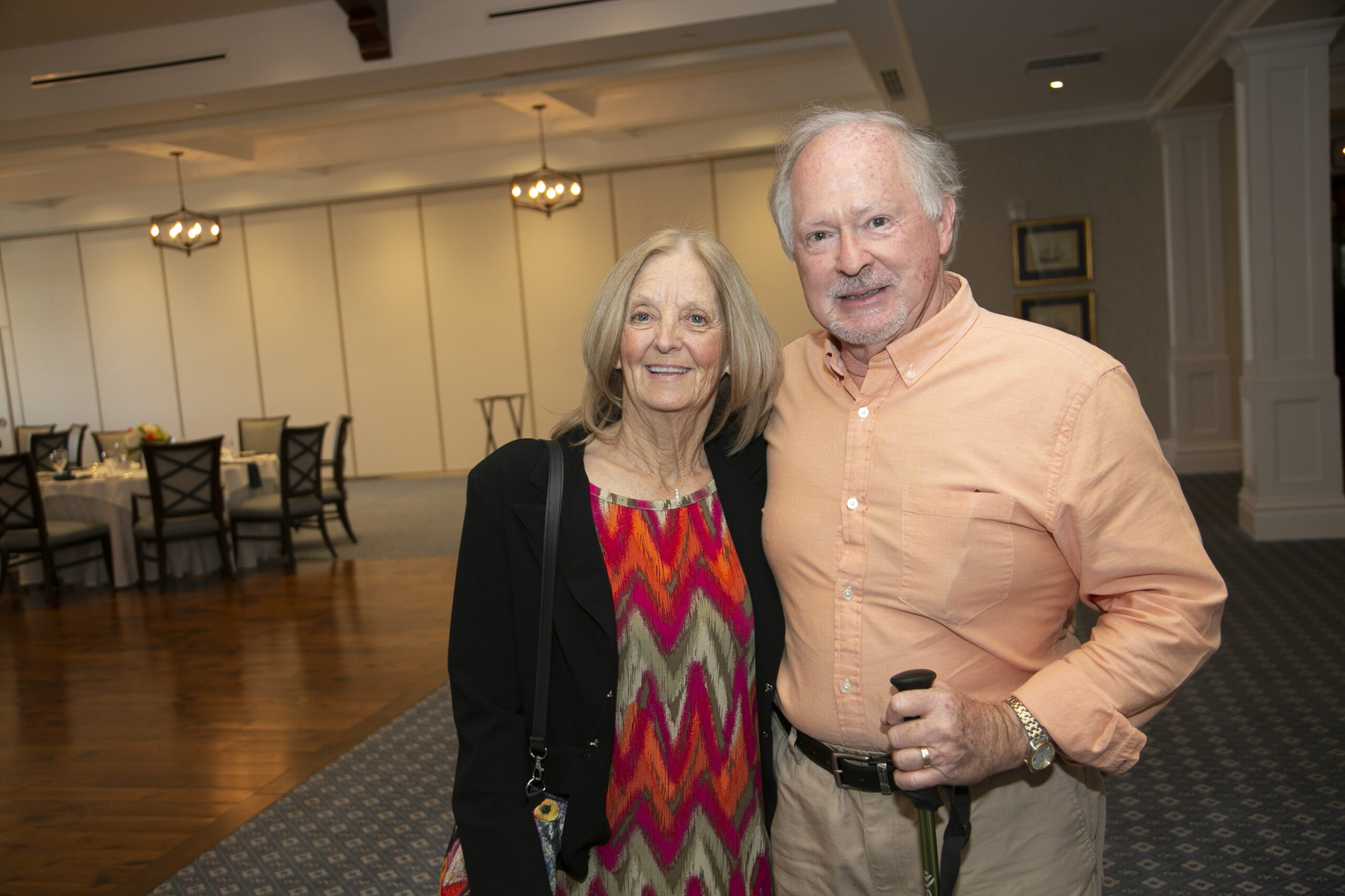 Man and woman posing for camera