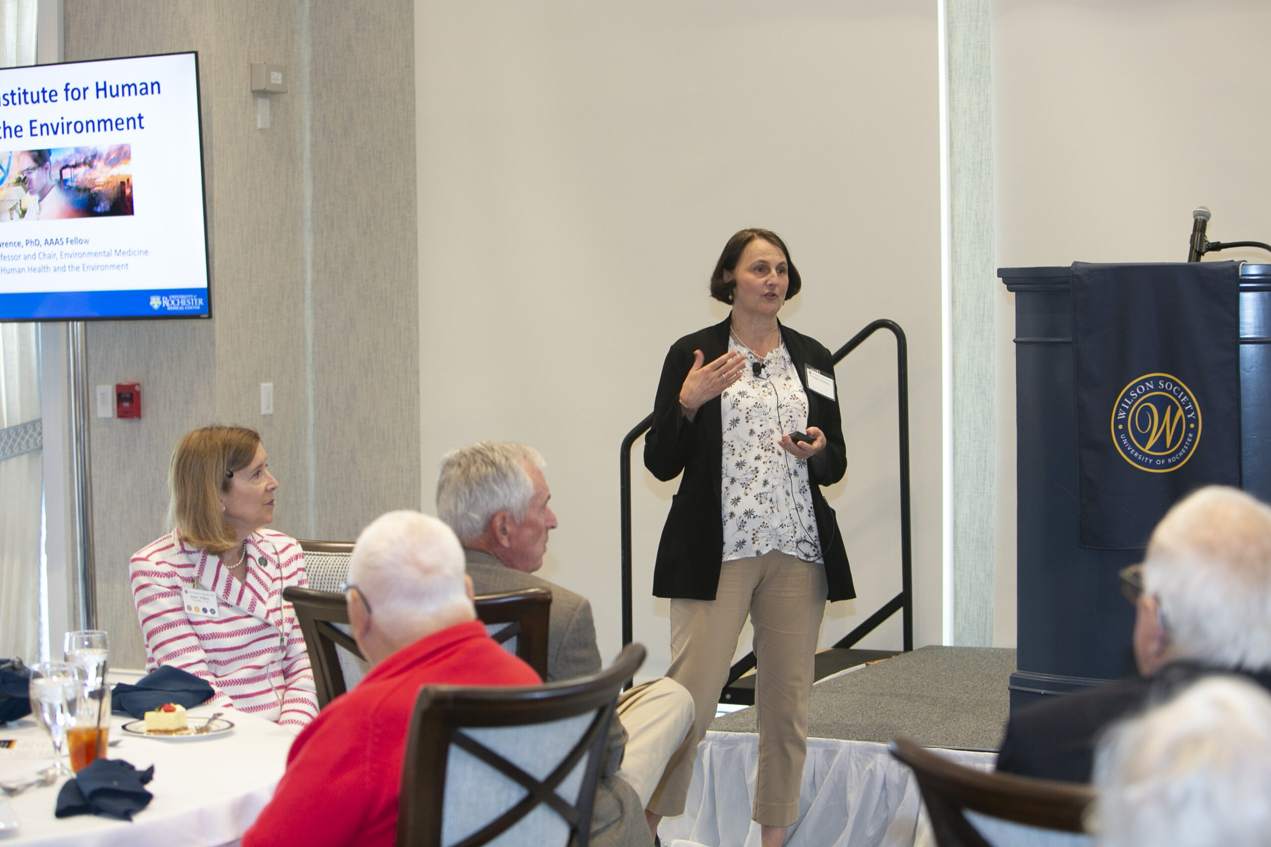 A woman speaking to an audience