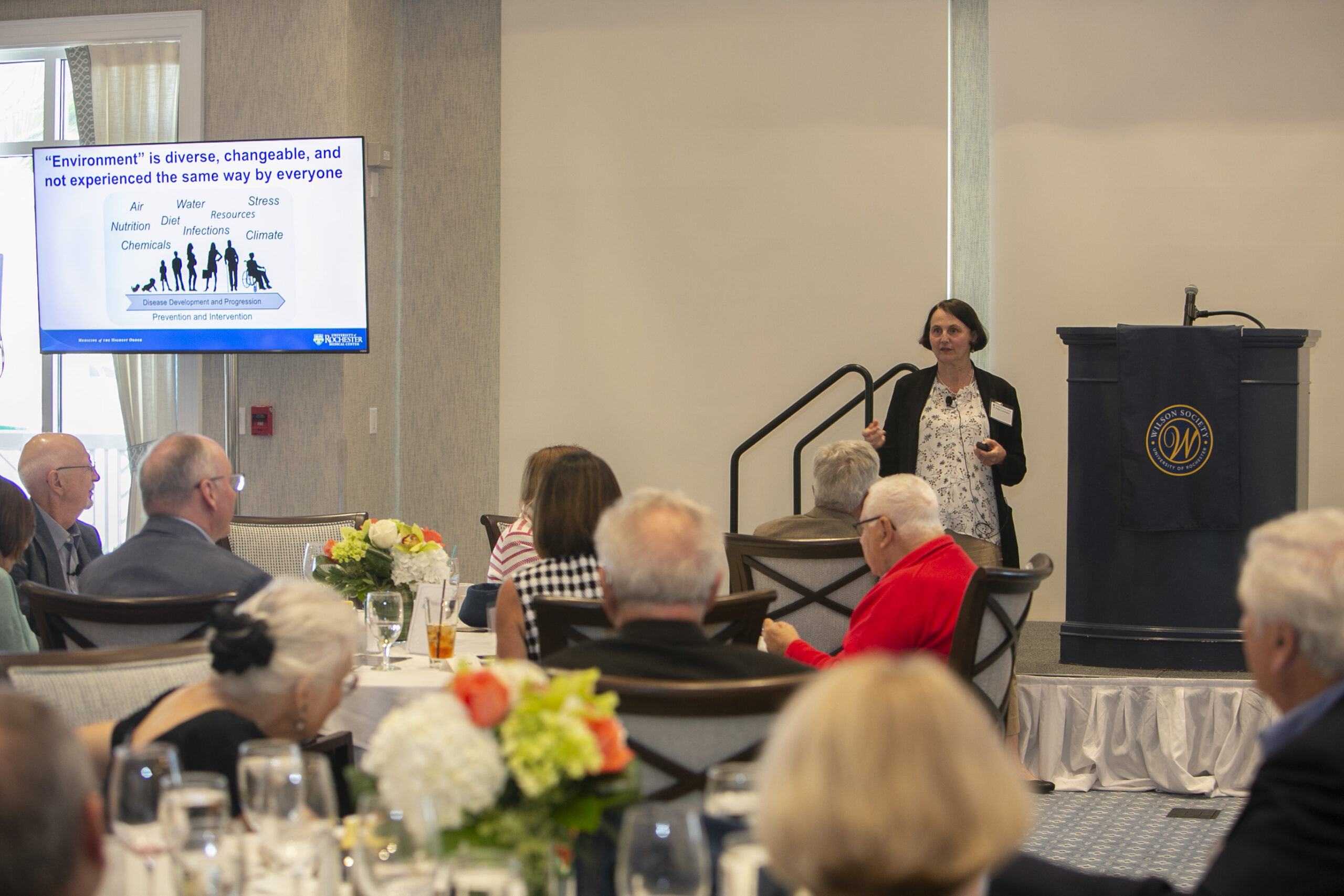 A woman speaking to an audience