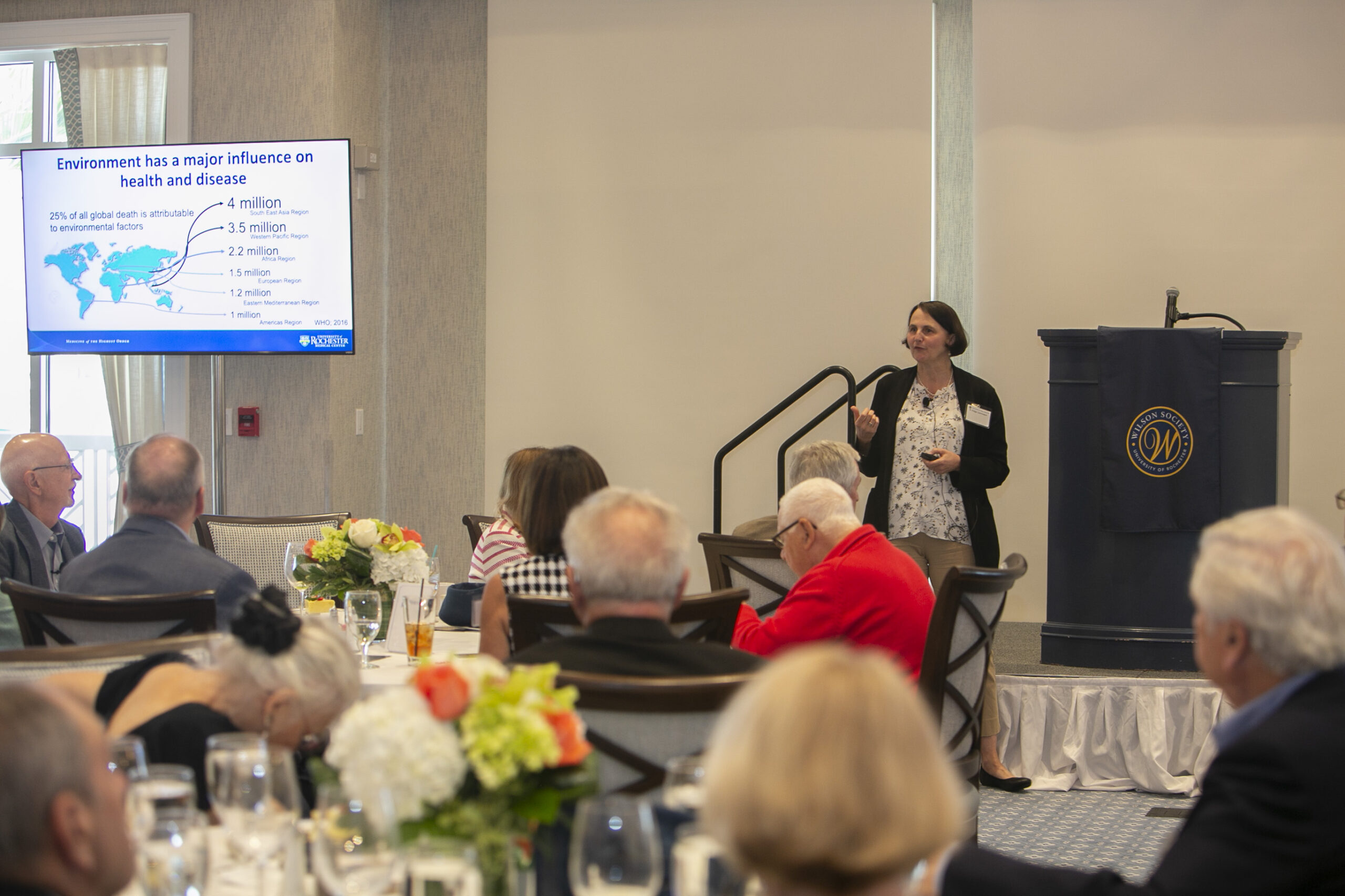 A woman speaking to an audience