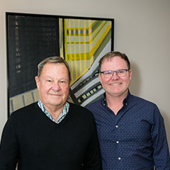 John Storz poses for a photo with a friend.
