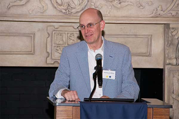 Dr. Jonathon Friedberg speaking at a lecturn