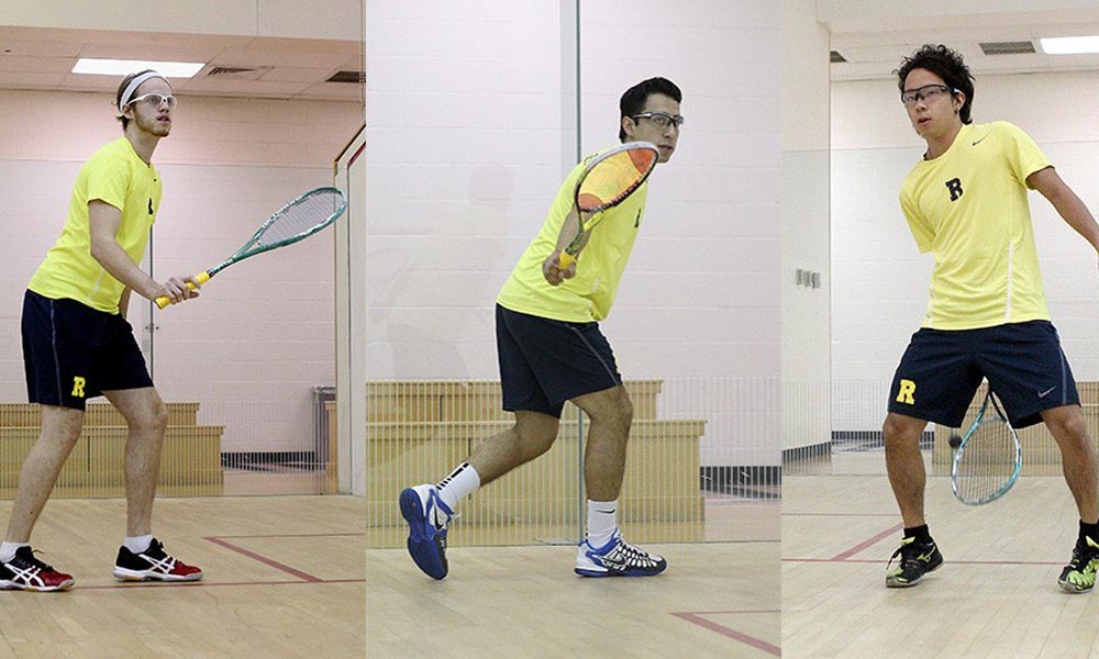 3 students playing squash