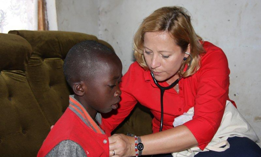 doctor listens to a child's heart with stethoscope