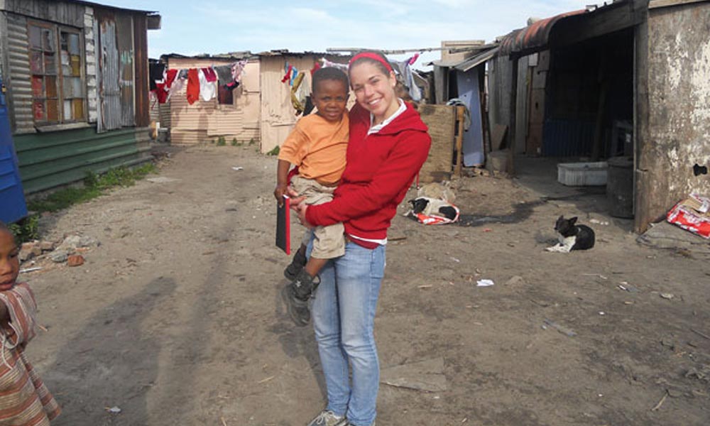 Katherine Wegman ’15 holding child in South Africa