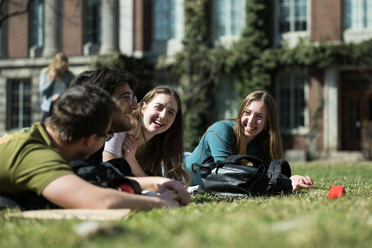 Sudents enjoy a warm afternoon on Eastman Quad at University of Rochester’s River Campus