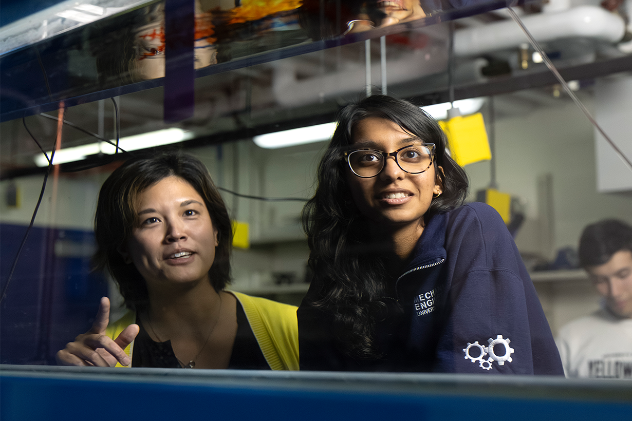 Two students in an engineering lab.