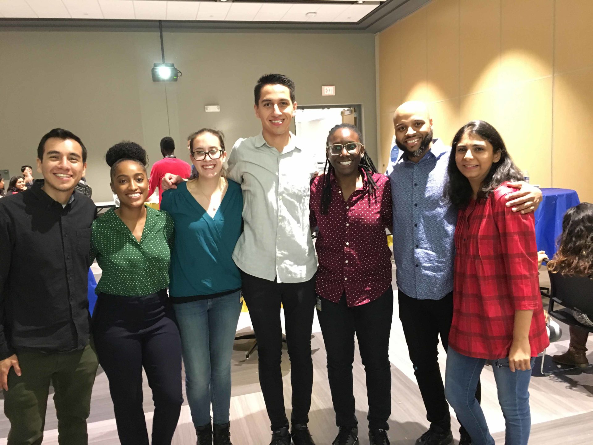 A group of University of Rochester students at an Alliance for Diversity in Science and Engineering event smiling together