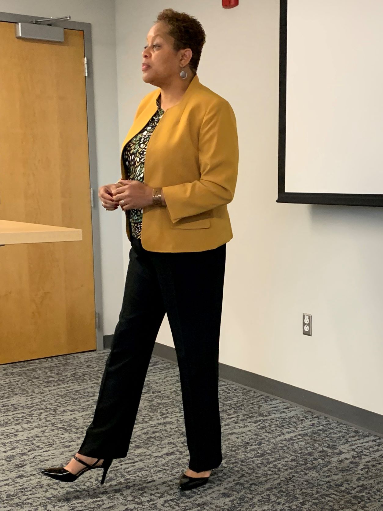 Dr. Valeria Sinclair-Chapman presenting in front of a classroom