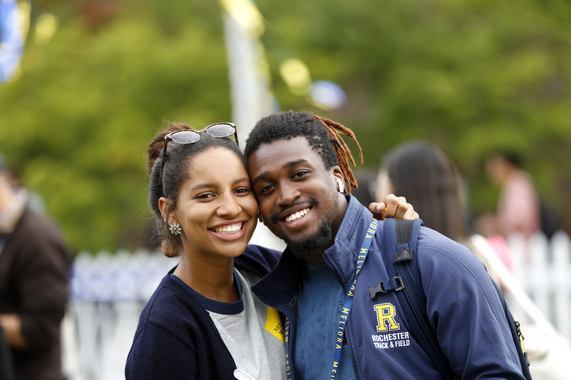 Two family members outside celebrating University of Rochester's Meliora Weekend