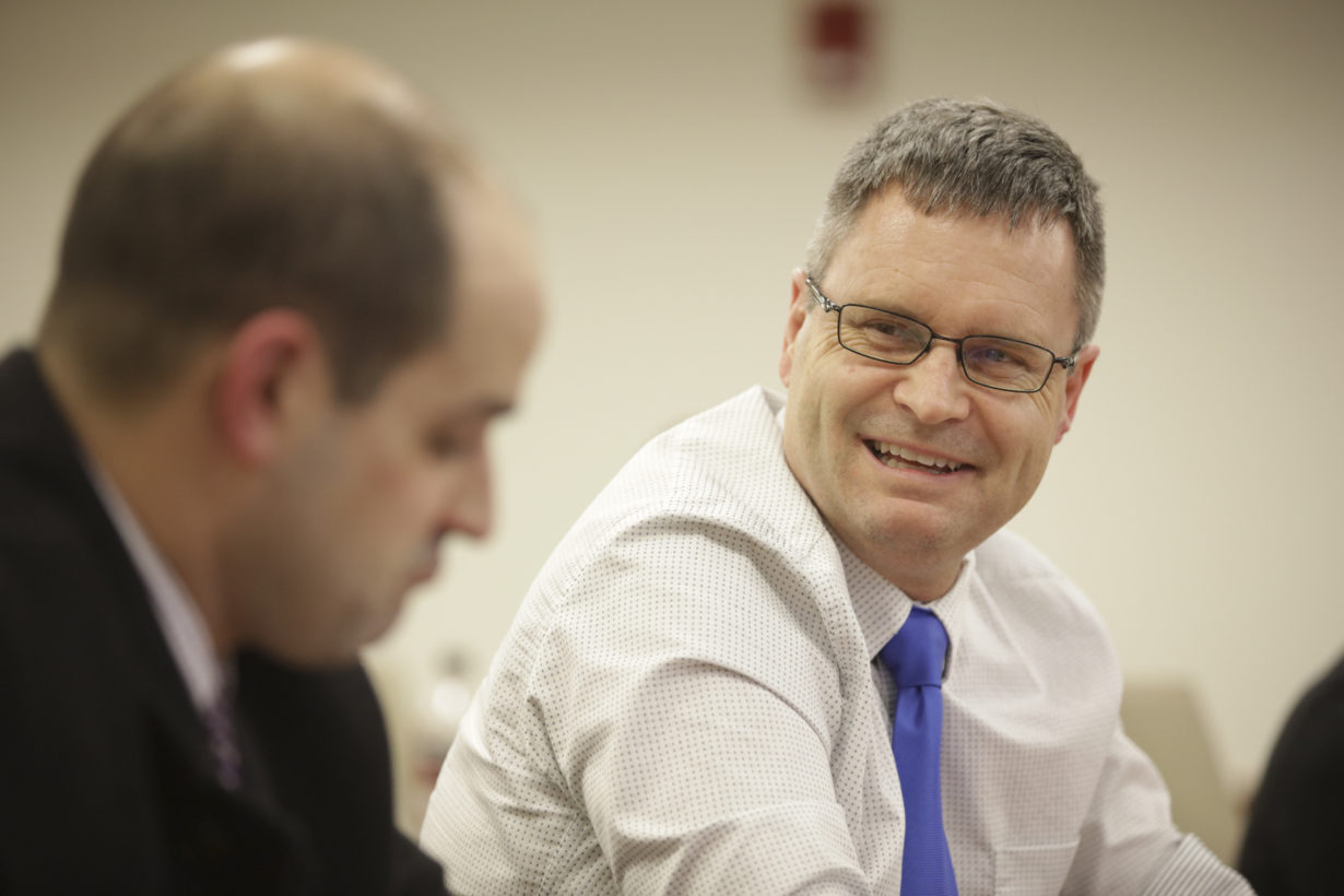 Business professional smiling at a colleague