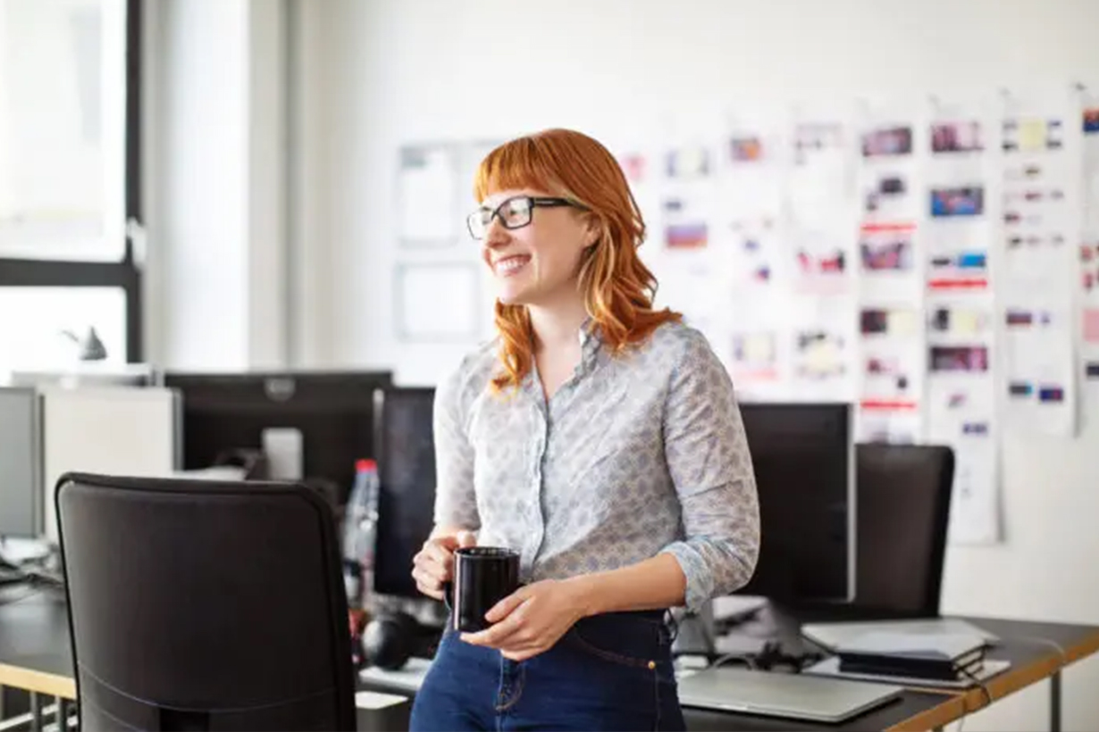 Businesswoman having a coffee break in office
