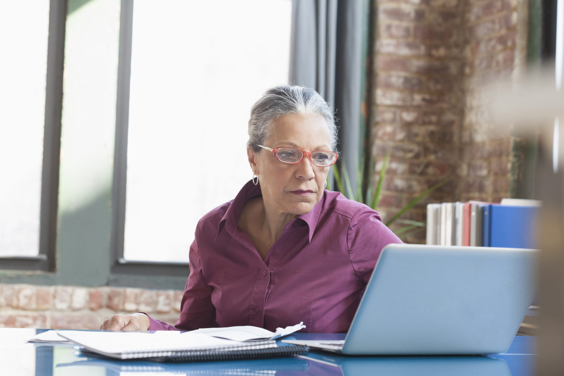 businesswoman using laptop in office