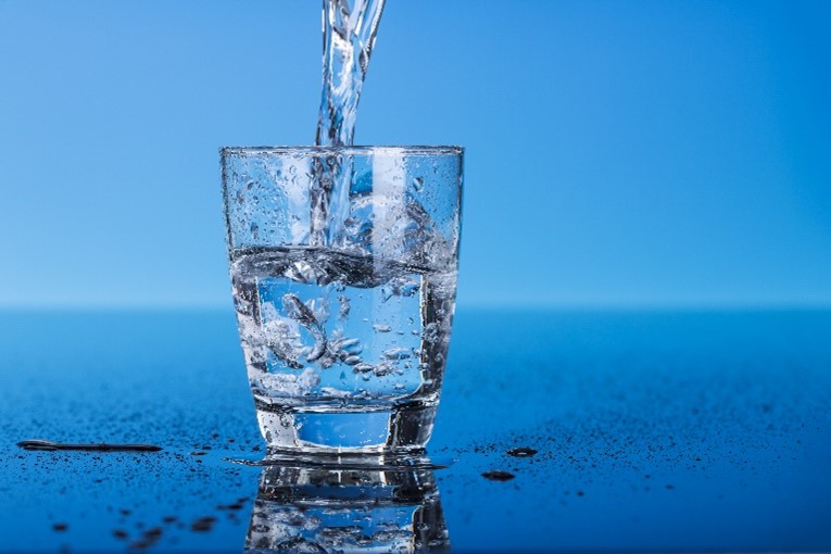 A glass being filled with fresh water