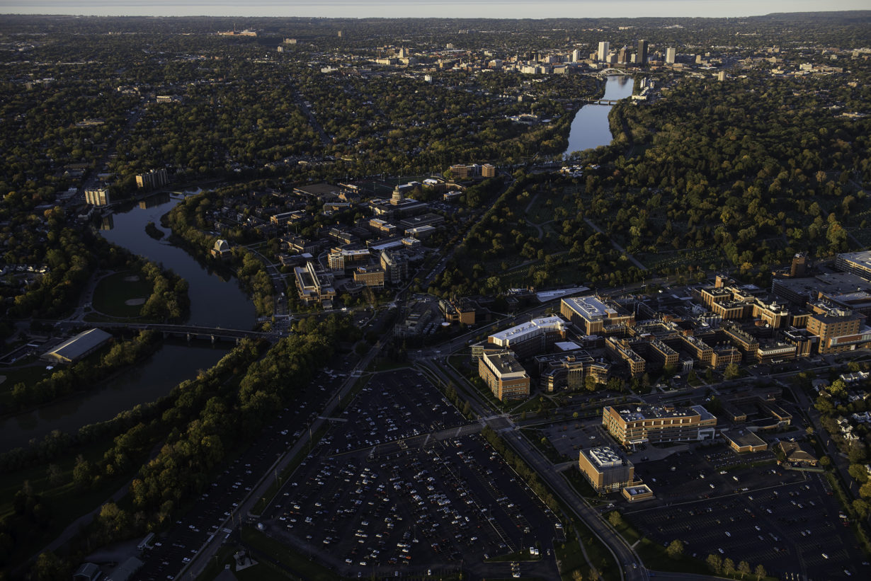 aerial photo of the University of Rochester campuses with the city of Rochester in the background