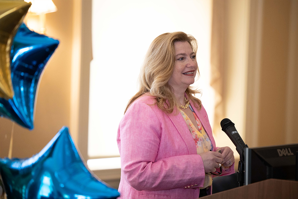 Chief Human Resources Officer Kathleen Gallucci speaking at a podium.