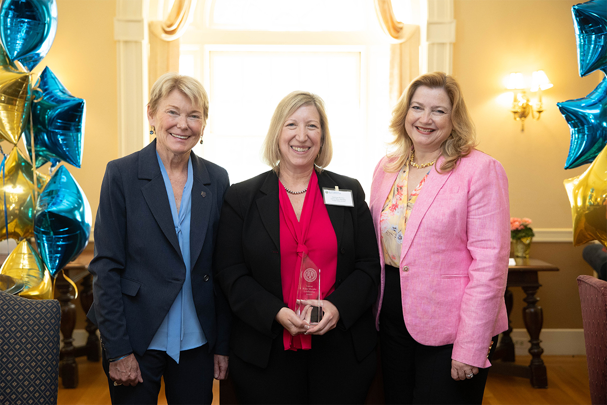 Christine Brower, (center) IT associate director, research product management enterprise data and analytics, information systems division, receives the Lamar Riley Murphy Leadership Award. Left: President Sarah Mangelsdorf; right: Kathleen Gallucci.