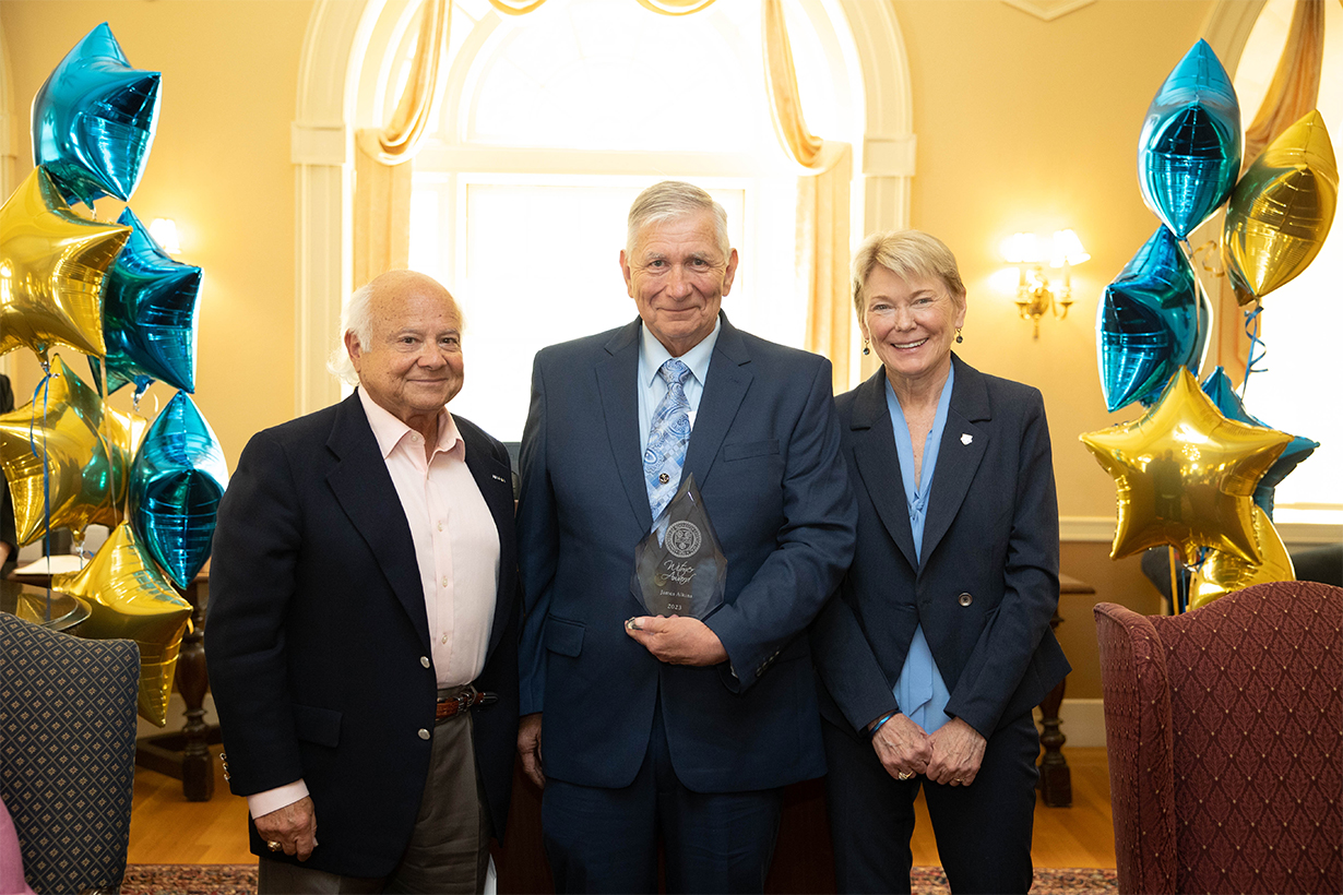 James Alkins (center) receives the Witmer Award for Distinguished Service. Left: Larry Kessler, trustee; right: President Sarah Mangelsdorf.
