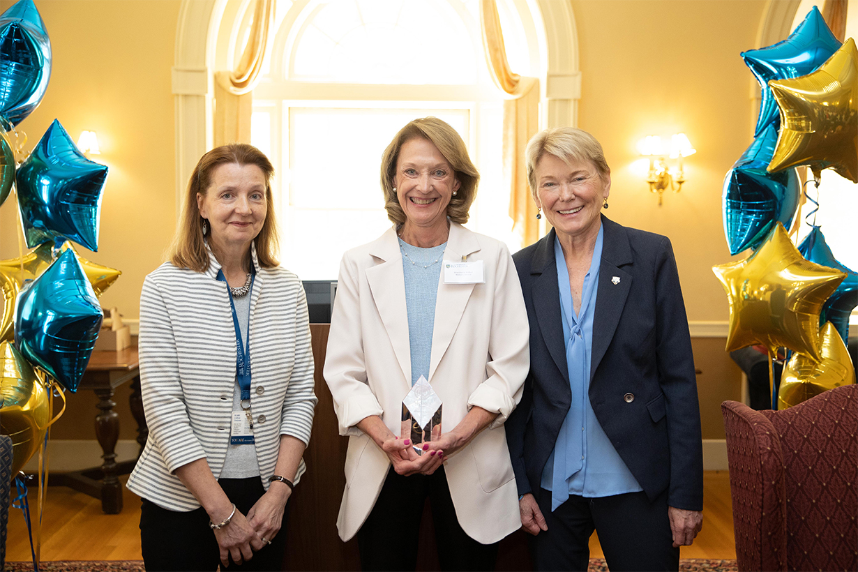 Rosemarie Kolker (center) receives the Meliora Award. Left: Teri D'Agostino; right: President Sarah Mangelsdorf.