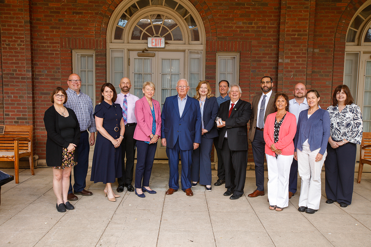 University of Rochester President Sarah Mangelsdorf and University of Rochester Vice President, Chief Human Resources Officer, Kathleen M. Gallucci and Board of Trustee Member Tom Richards give Meliora Award winner YoUR Support Team