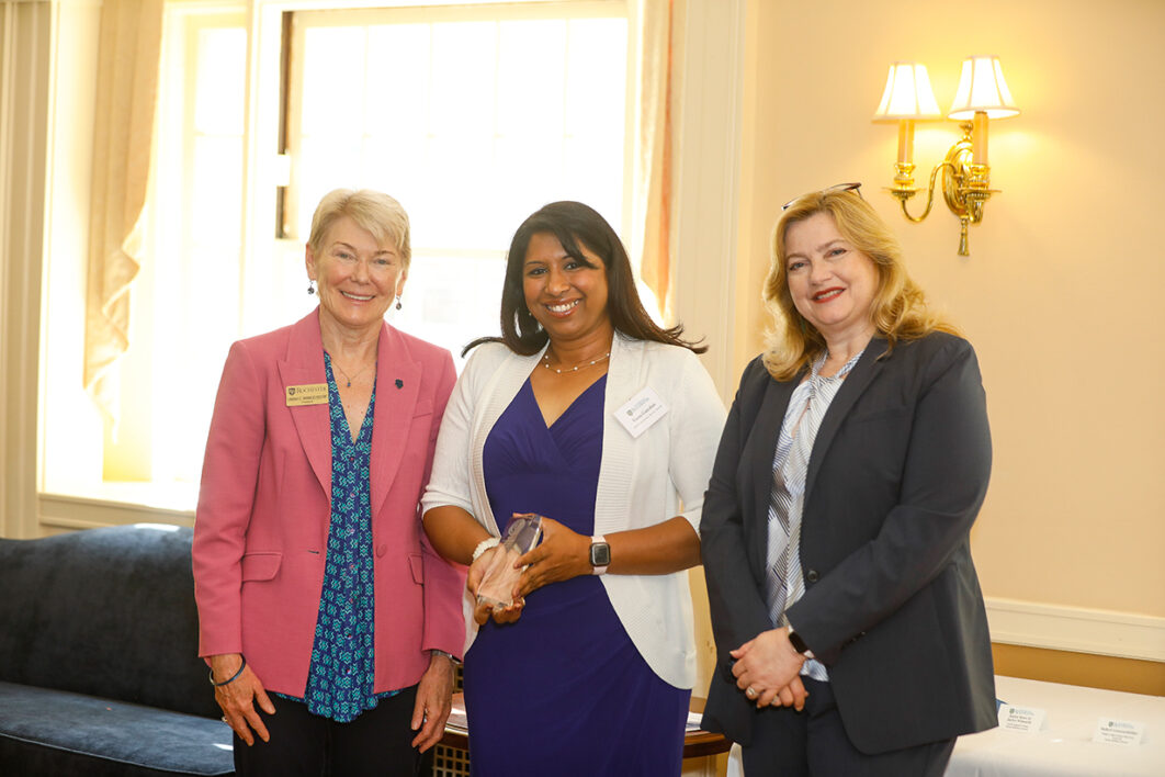 Staff Community Service Award winner, Veena Ganeshan poses with President Mangelsdorf and Kathleen M. Gallucci